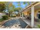 This backyard has a covered patio, garden shed, and well-maintained landscaping at 810 Socorro Song Ln, Henderson, NV 89052