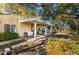 Spacious backyard featuring a covered patio, lush landscaping and mature trees at 810 Socorro Song Ln, Henderson, NV 89052