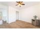 A carpeted bedroom with a closet with sliding doors and a ceiling fan at 810 Socorro Song Ln, Henderson, NV 89052