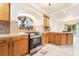 Bright kitchen features stainless steel appliances, light wood cabinets and ample countertop space at 810 Socorro Song Ln, Henderson, NV 89052