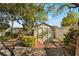 Exterior view of backyard shed featuring lush landscaping, with an attractive pathway at 810 Socorro Song Ln, Henderson, NV 89052