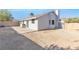 Spacious backyard with a concrete patio, desert landscaping, and block wall at 823 Crabapple Dr, Henderson, NV 89002