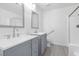 Updated bathroom with double sinks, modern fixtures, walk-in shower and plenty of light at 823 Crabapple Dr, Henderson, NV 89002