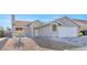 Attractive single-story home with a two-car garage, neutral color palette, and rock landscaping at 823 Crabapple Dr, Henderson, NV 89002