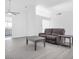 Cozy living room with ample natural light, grey hardwood floors and neutral walls at 823 Crabapple Dr, Henderson, NV 89002