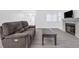 Inviting living room features a fireplace, hardwood floors, and a two-seat reclining couch at 823 Crabapple Dr, Henderson, NV 89002