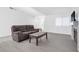 Open living room features an electric fireplace, hardwood flooring, and abundant natural light at 823 Crabapple Dr, Henderson, NV 89002