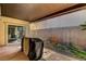 Covered patio with seating area and grill, perfect for outdoor entertaining at 8560 Alocasia Ct, Las Vegas, NV 89149
