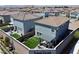 The aerial view shows a low maintenance backyard with artificial turf, a brick patio and an outdoor lounge area at 8710 Beverly Grove Ct, Las Vegas, NV 89113