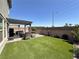 Inviting backyard with pergola, artificial turf, hardscape, and space for outdoor relaxation at 8710 Beverly Grove Ct, Las Vegas, NV 89113