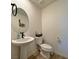 Bathroom with modern sink, toilet, and neutral decor at 8710 Beverly Grove Ct, Las Vegas, NV 89113