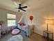 Cozy bedroom with fan, playful decor, and plenty of natural light from the window at 8710 Beverly Grove Ct, Las Vegas, NV 89113