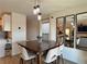 Dining room featuring modern lighting and decor with a view into the living room at 8710 Beverly Grove Ct, Las Vegas, NV 89113
