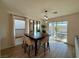 Bright dining area with sliding glass doors to the backyard at 8710 Beverly Grove Ct, Las Vegas, NV 89113