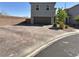 Charming two-story home features brick driveway, a two-car garage, and xeriscape landscaping at 8710 Beverly Grove Ct, Las Vegas, NV 89113