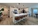 Kitchen featuring a center island with breakfast bar seating, stainless appliances, and open layout at 8710 Beverly Grove Ct, Las Vegas, NV 89113