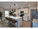 Bright, spacious kitchen features a large island with seating, stainless appliances, and ample counter space at 8710 Beverly Grove Ct, Las Vegas, NV 89113