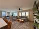 Open-concept living spaces with dining area, kitchen, and cozy living room at 8710 Beverly Grove Ct, Las Vegas, NV 89113
