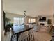 Open-concept living spaces featuring a dining room, living room, and patio access at 8710 Beverly Grove Ct, Las Vegas, NV 89113