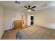 Bright main bedroom with a view to the ensuite bathroom and carpet floors at 8710 Beverly Grove Ct, Las Vegas, NV 89113