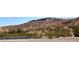 Scenic view of a desert mountain with hiking trails and native vegetation at 8710 Beverly Grove Ct, Las Vegas, NV 89113