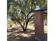 A shady park view featuring lush grass, mature trees, and a brick picnic shelter at 8710 Beverly Grove Ct, Las Vegas, NV 89113