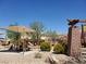 Outdoor playground structure with picnic tables, sunshades, and desert landscaping at 8710 Beverly Grove Ct, Las Vegas, NV 89113