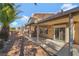 Home's backyard is set up for entertaining with a covered patio and outdoor kitchen at 9785 Gallo Dr, Las Vegas, NV 89147