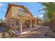 A covered patio spans the length of this home's backyard at 9785 Gallo Dr, Las Vegas, NV 89147