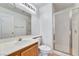 Clean bathroom with a large mirror, shower, and wood-finished vanity, offering functionality at 9785 Gallo Dr, Las Vegas, NV 89147