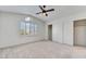 Bedroom with vaulted ceiling, plantation shutters, large closets, and natural light at 9785 Gallo Dr, Las Vegas, NV 89147