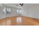 A spacious bedroom features a ceiling fan and plantation shutters on the windows at 9785 Gallo Dr, Las Vegas, NV 89147