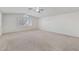 Spacious bedroom featuring a vaulted ceiling, plantation shutters, and ample natural light at 9785 Gallo Dr, Las Vegas, NV 89147