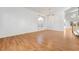 An open living space featuring hardwood floors, large windows, and neutral paint at 9785 Gallo Dr, Las Vegas, NV 89147