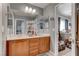 Modern bathroom with double sinks, spacious vanity, and well-lit mirror at 10422 Prairie Mountain Ave, Las Vegas, NV 89166