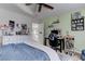 Bright, decorated bedroom with desk, a ceiling fan, and ample natural light at 10422 Prairie Mountain Ave, Las Vegas, NV 89166