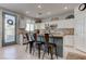 Bright eat-in kitchen features white cabinets, granite countertops and stainless steel appliances at 10422 Prairie Mountain Ave, Las Vegas, NV 89166