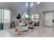 Spacious living room featuring high ceilings and natural light from the large windows at 10422 Prairie Mountain Ave, Las Vegas, NV 89166