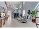 Inviting living room with high ceilings, a staircase, stylish decor, and ample natural light at 10422 Prairie Mountain Ave, Las Vegas, NV 89166