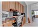 Built-in wooden office cabinets with a desk and chair, creating an organized workspace at 10422 Prairie Mountain Ave, Las Vegas, NV 89166