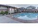 Community pool featuring a shower and nearby outdoor seating at 10422 Prairie Mountain Ave, Las Vegas, NV 89166