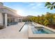 Inviting backyard with a pool, spa, and outdoor lounge area, ideal for relaxation and entertainment at 10482 Calico Terrace Ave, Las Vegas, NV 89135