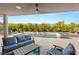 Relaxing backyard featuring a pool, spa, water features, and comfortable lounge area with plush blue cushions at 10482 Calico Terrace Ave, Las Vegas, NV 89135