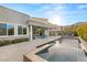 Stunning backyard with a pool, spa, built-in grill, and comfortable seating, perfect for outdoor living at 10482 Calico Terrace Ave, Las Vegas, NV 89135
