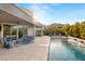 Backyard oasis features a pool, spa, and outdoor kitchen, perfect for entertaining guests at 10482 Calico Terrace Ave, Las Vegas, NV 89135