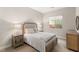 Cozy bedroom showcasing a comfortable bed, neutral tones, and ample natural light at 10482 Calico Terrace Ave, Las Vegas, NV 89135