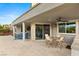 Spacious covered patio with an outdoor kitchen and dining area, perfect for enjoying the outdoors at 10482 Calico Terrace Ave, Las Vegas, NV 89135