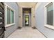 Inviting courtyard entrance with a modern design, stylish door, and well-placed lighting for curb appeal at 10482 Calico Terrace Ave, Las Vegas, NV 89135