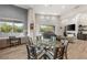 Bright and airy living area seamlessly flows from the kitchen and dining area at 10482 Calico Terrace Ave, Las Vegas, NV 89135