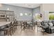 Bright and airy living area with island flows from the kitchen and stainless appliances at 10482 Calico Terrace Ave, Las Vegas, NV 89135